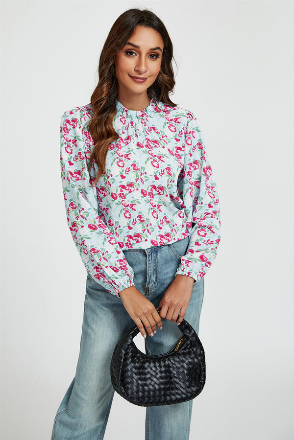 Top met hoge hals en bloemenprint, volantdetail in blauw en roze