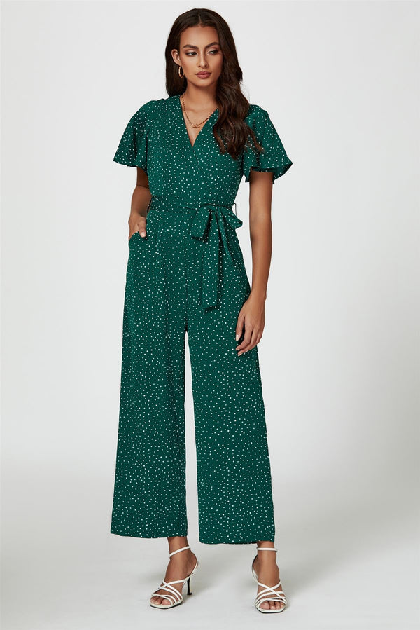 Grüner Jumpsuit mit Wickeloberteil und Punktmuster