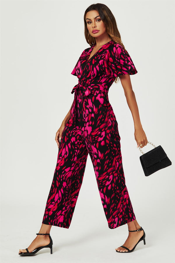 Rosa Jumpsuit mit abstraktem Print und Wickeloberteil in Schwarz